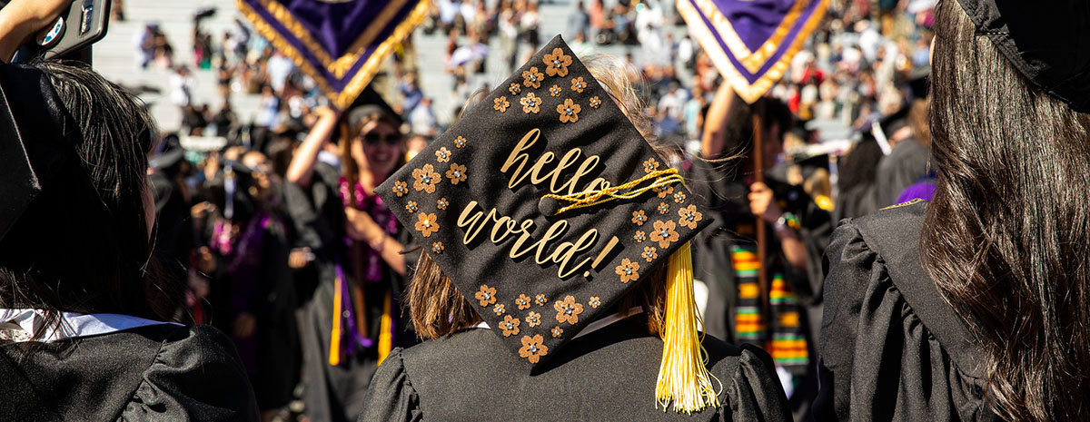 graduation cap with the words 'hello world'